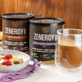 Pack de Zenergy Coffee con Smart Energy Espresso y Choco Charge junto a una taza preparada y un bol de desayuno con fruta y granola